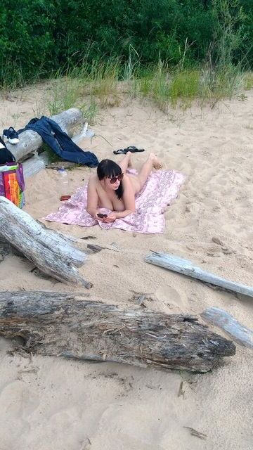 Hairy brunette Russian milf on the beach