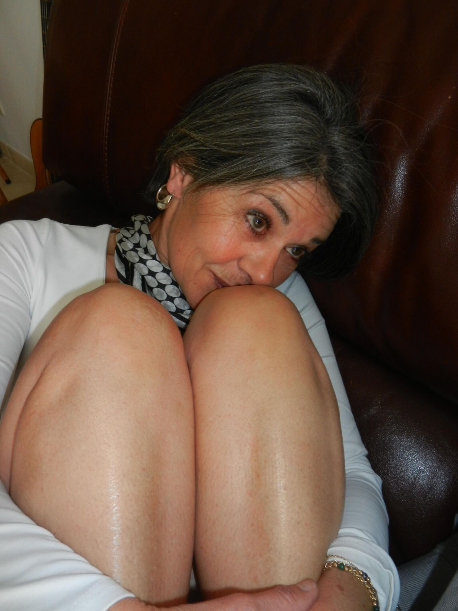 Shy skinny mature Beatrice undressing on sofa in living room HD
