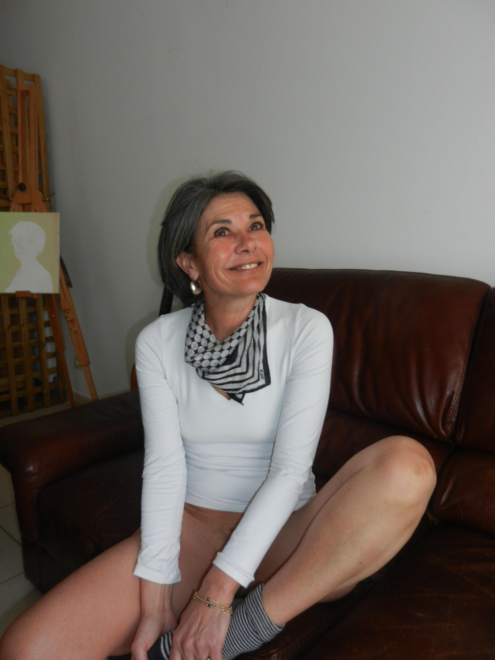 Shy skinny mature Beatrice undressing on sofa in living room HD