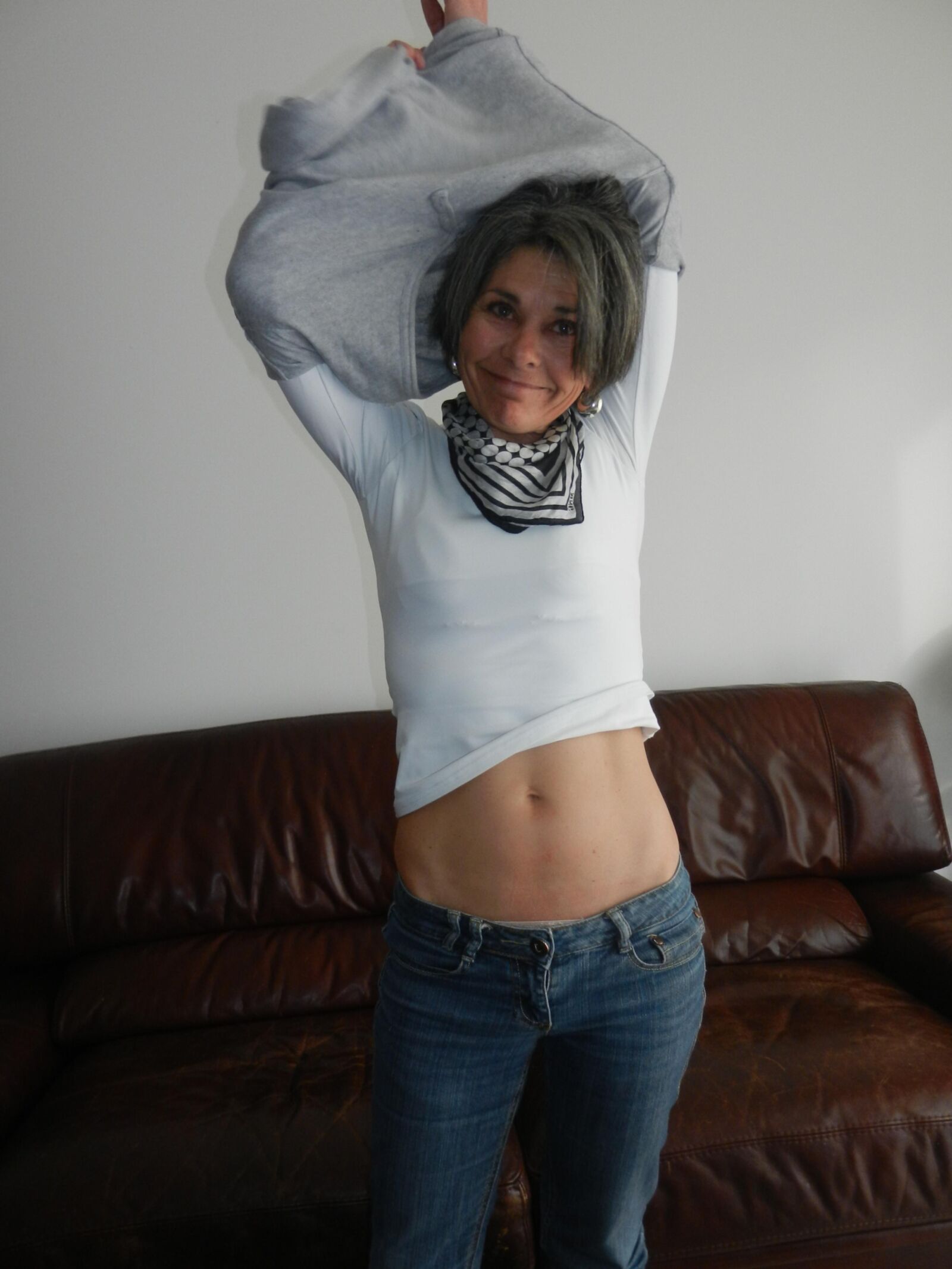 Shy skinny mature Beatrice undressing on sofa in living room HD