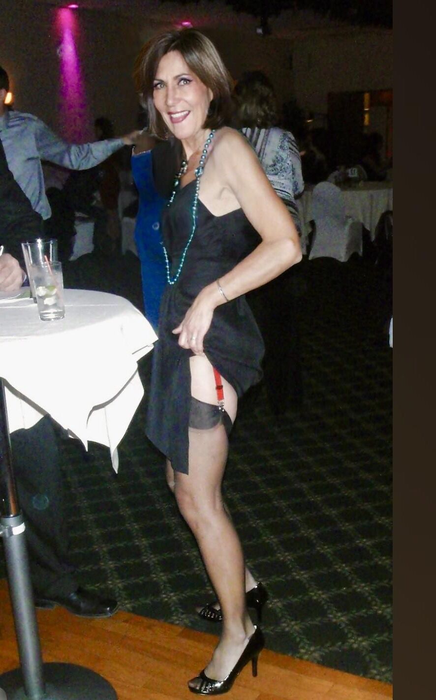 Showing off her stocking tops at family wedding 