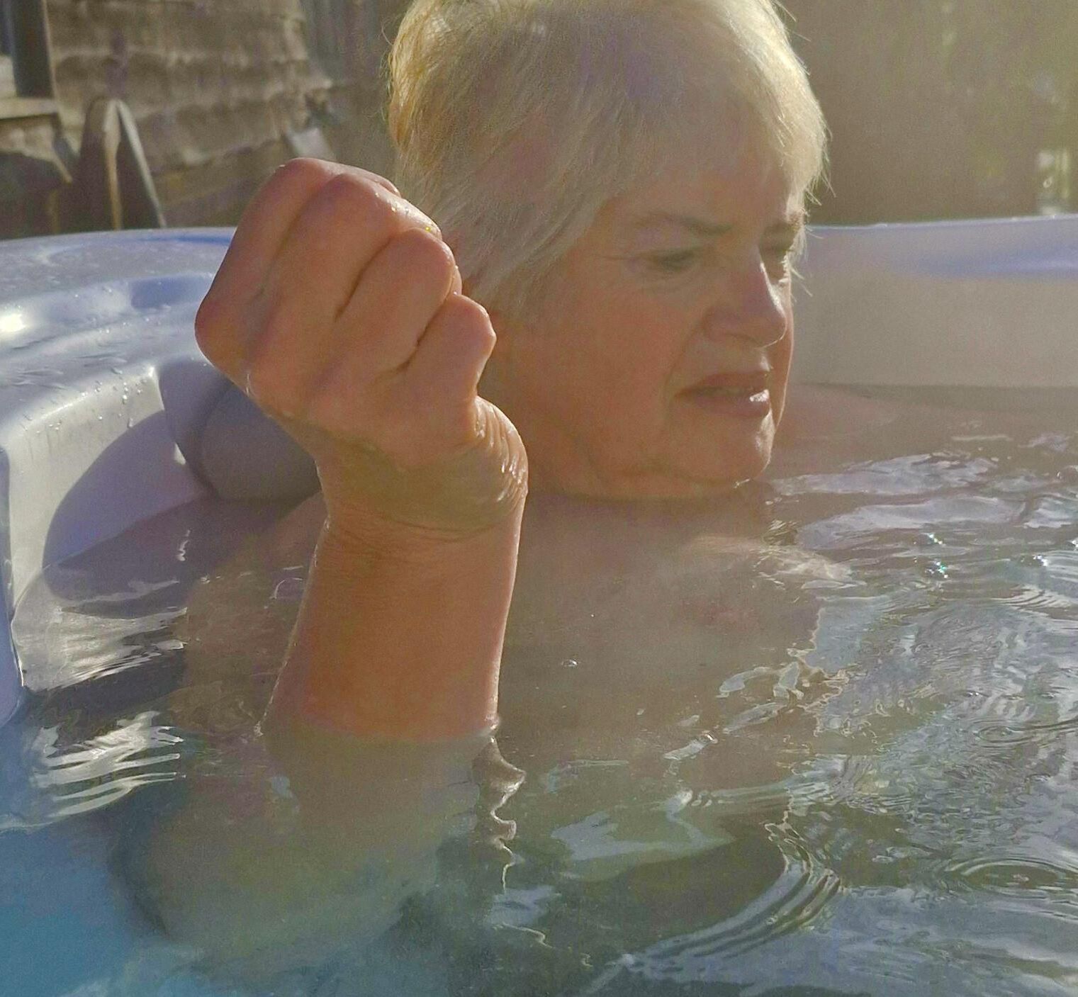 Mom topless in hot tub….teasing son