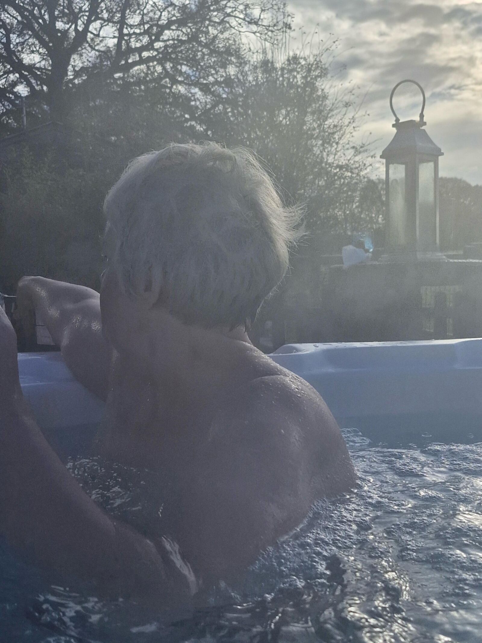 Mom topless in hot tub….teasing son