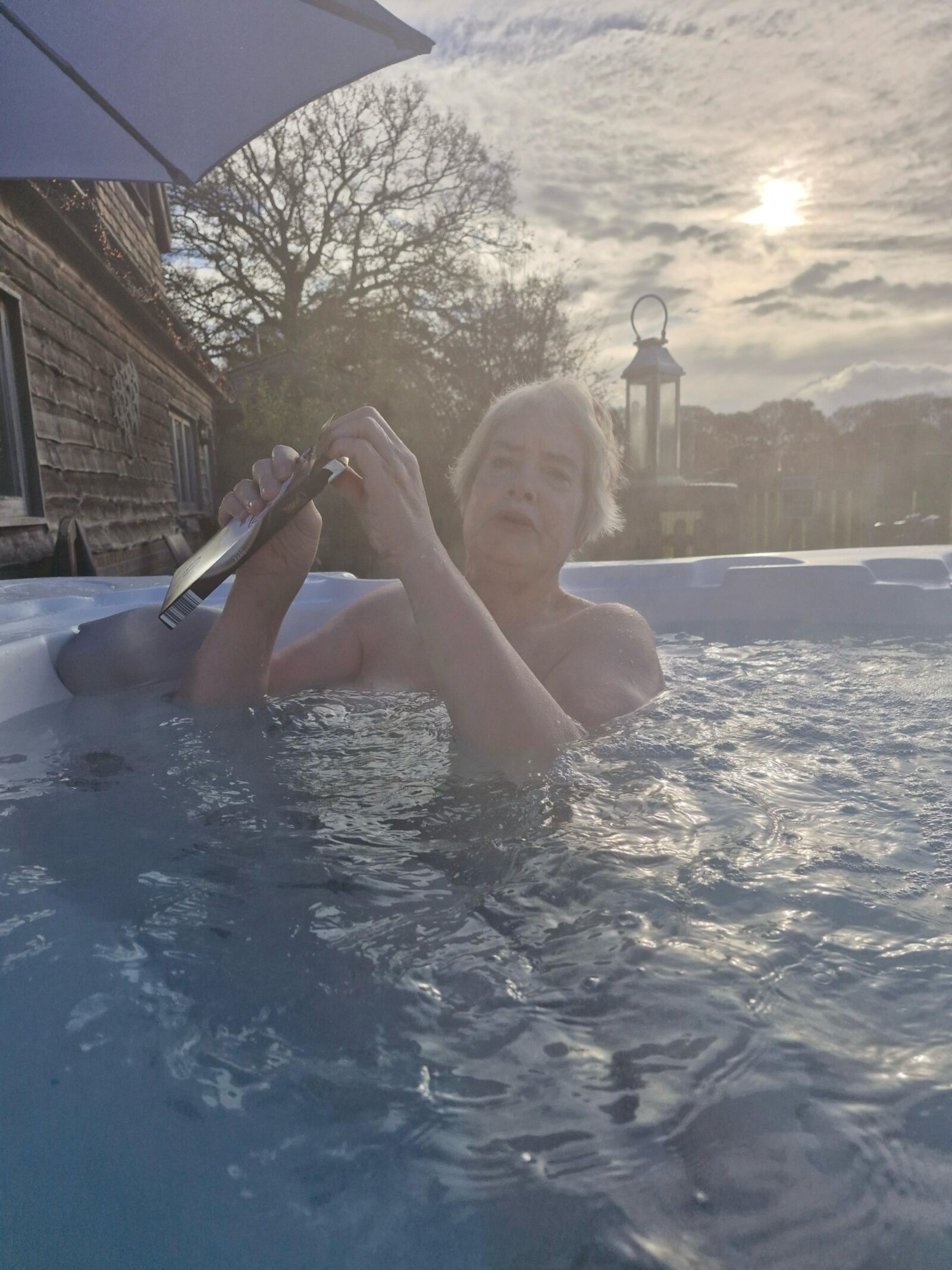 Mom topless in hot tub….teasing son