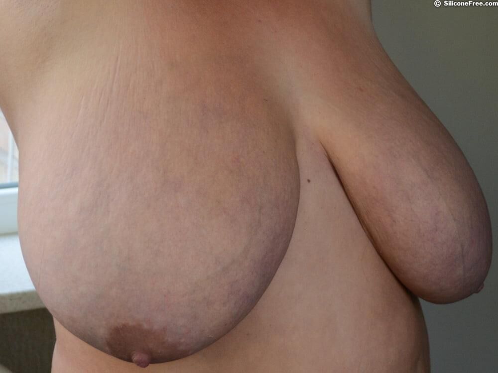 Mature brunette with big saggy boobs