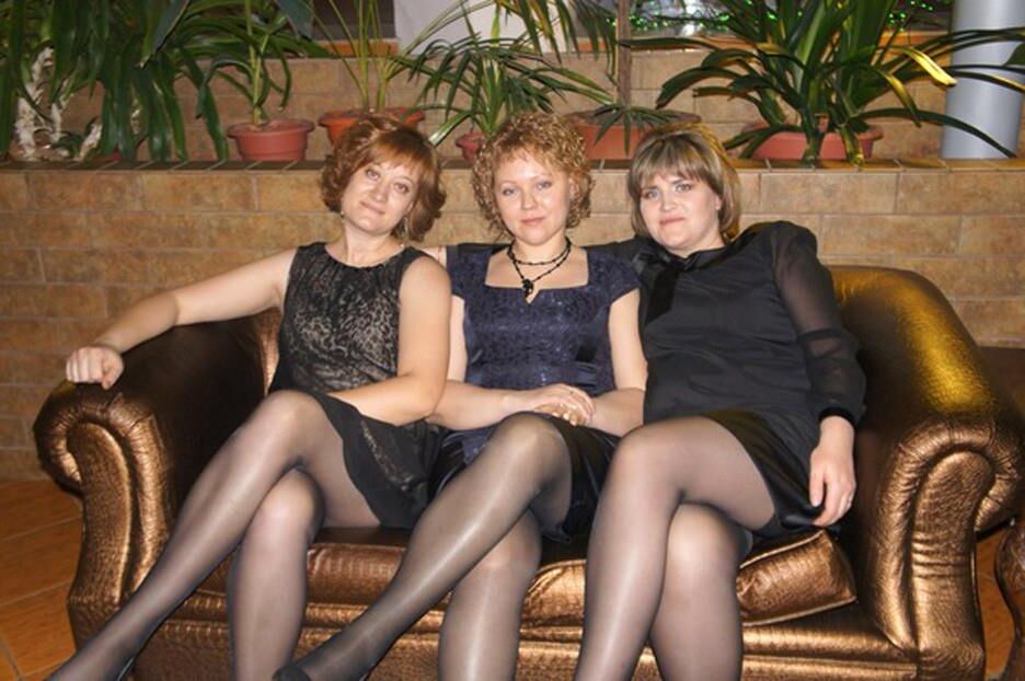 . Women fully dressed, no nudes
