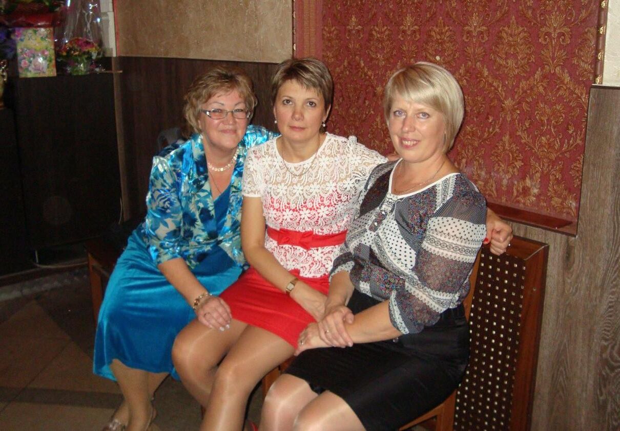 . Women fully dressed, no nudity