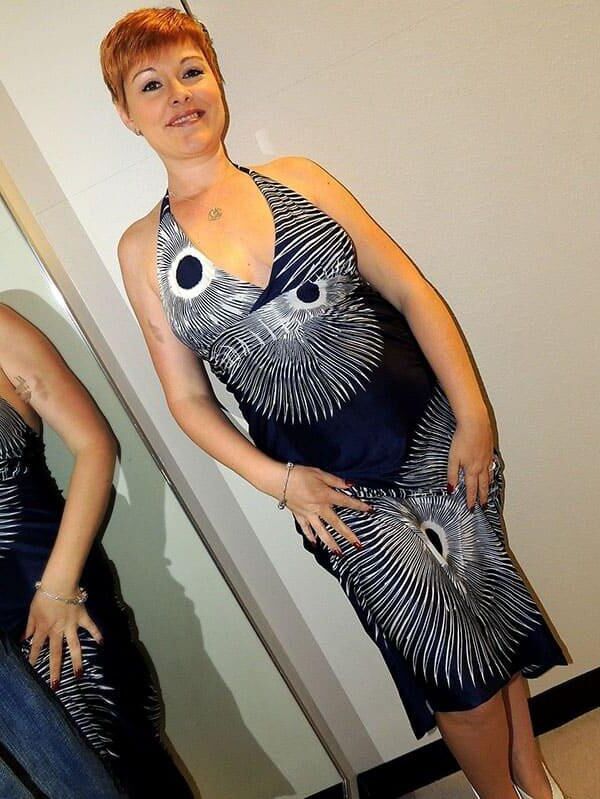Elegant milf make striptease in shoping center