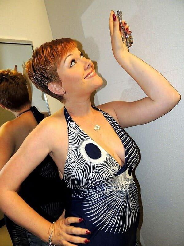 Elegant milf make striptease in shoping center