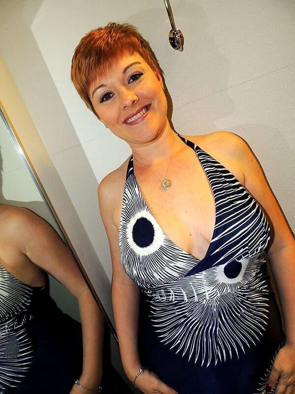 Elegant milf make striptease in shoping center