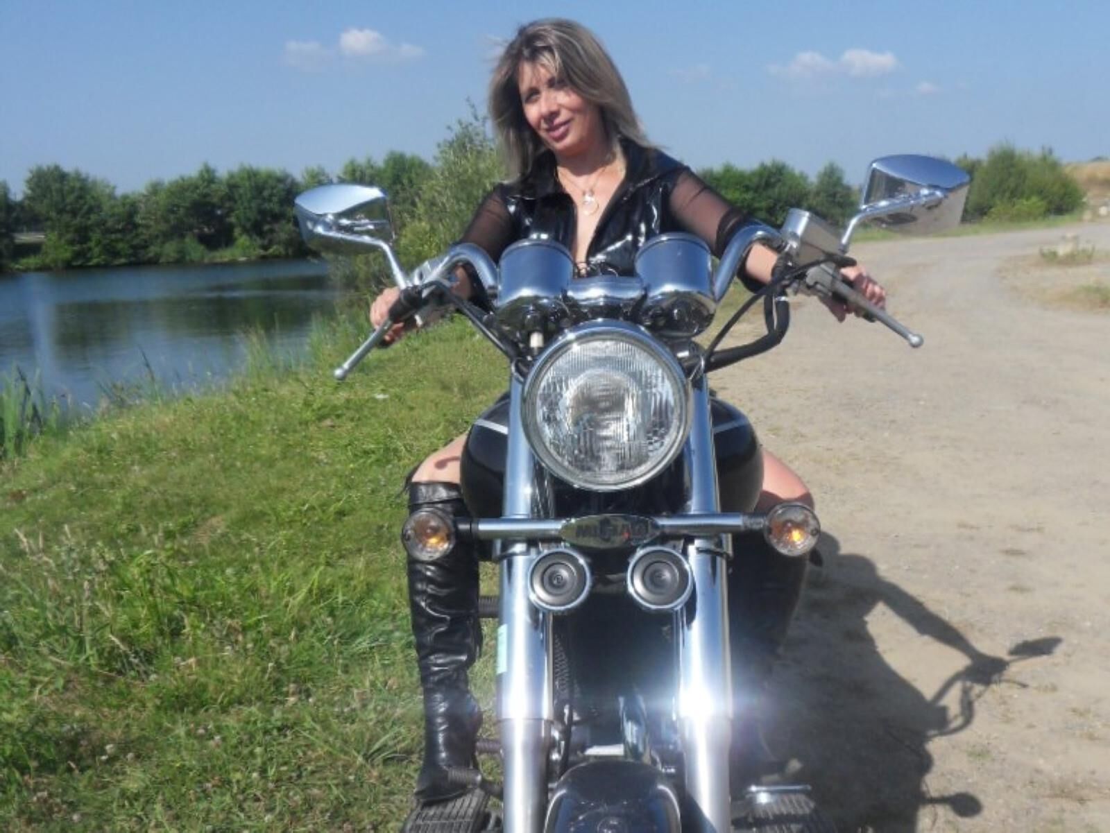 Lisa in a slut outfit on the motorcycle