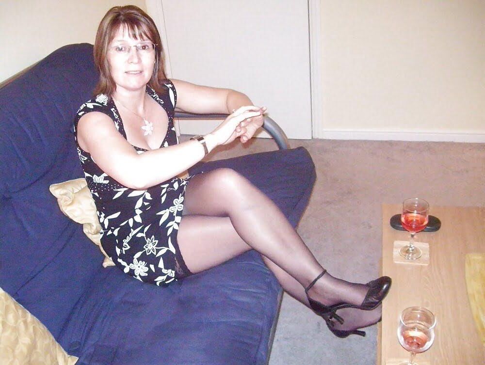 Mom, everybody can see your stockings tops 